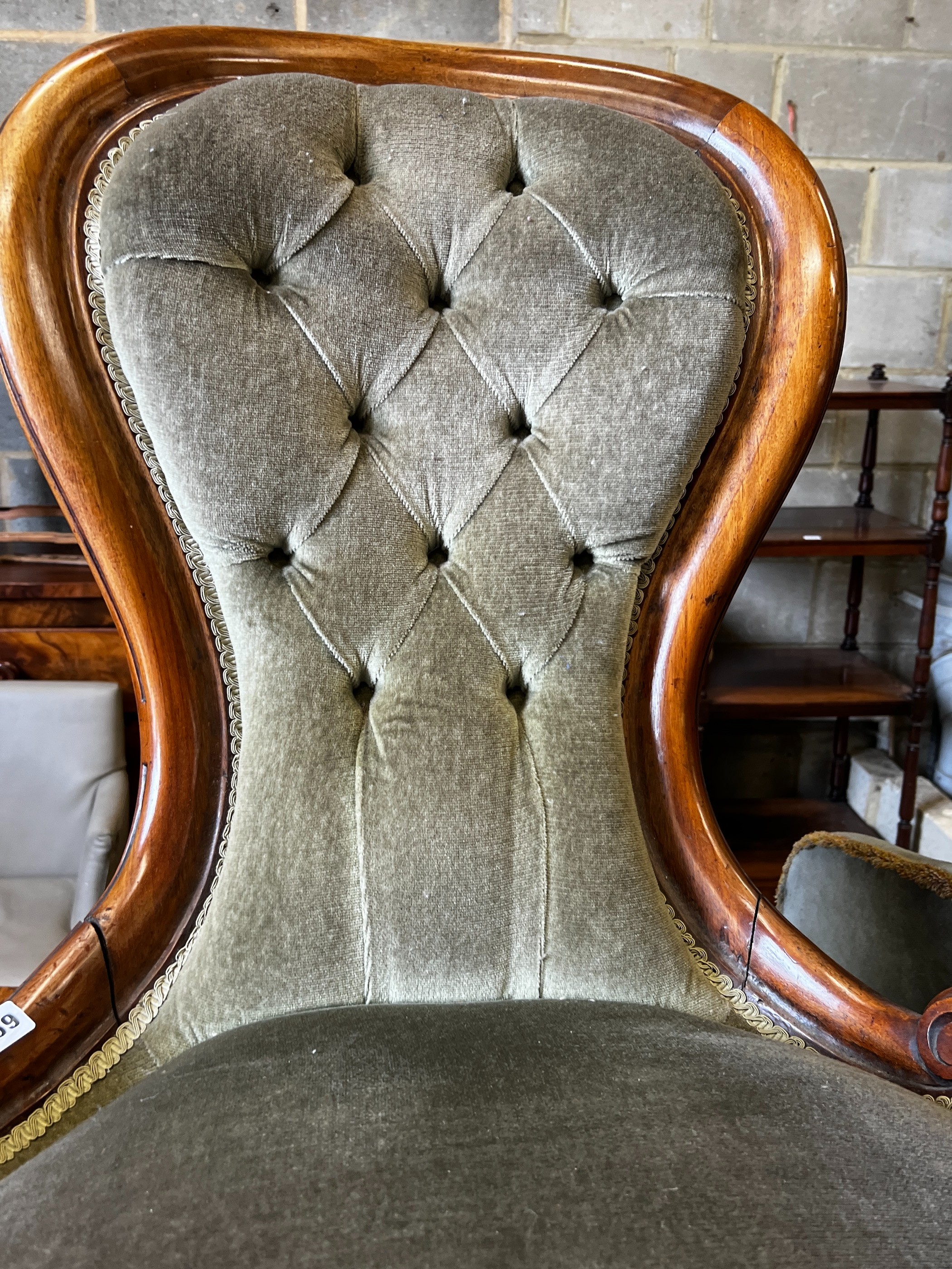 A pair of Victorian mahogany spoon back nursing chairs, width 57cm, depth 57cm, height 91cm